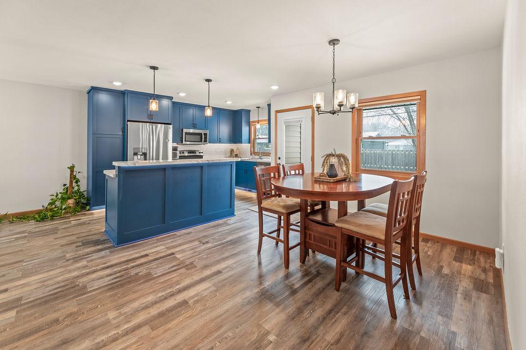 Open-concept kitchen & dining w/ views to backyard