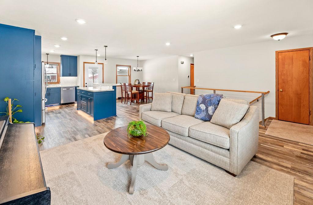 Bright living room w/ views to kitchen & dining