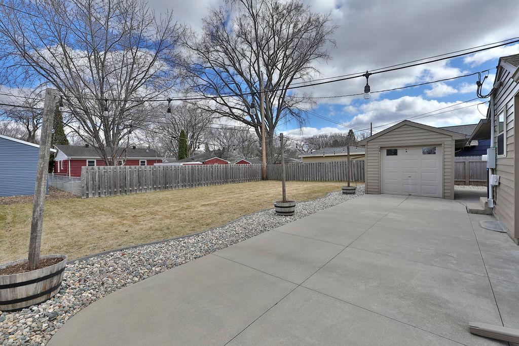 Large patio, landscaping, mostly fenced