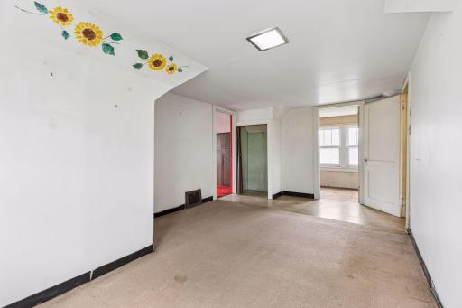 Upper level flex space with walk in closet.