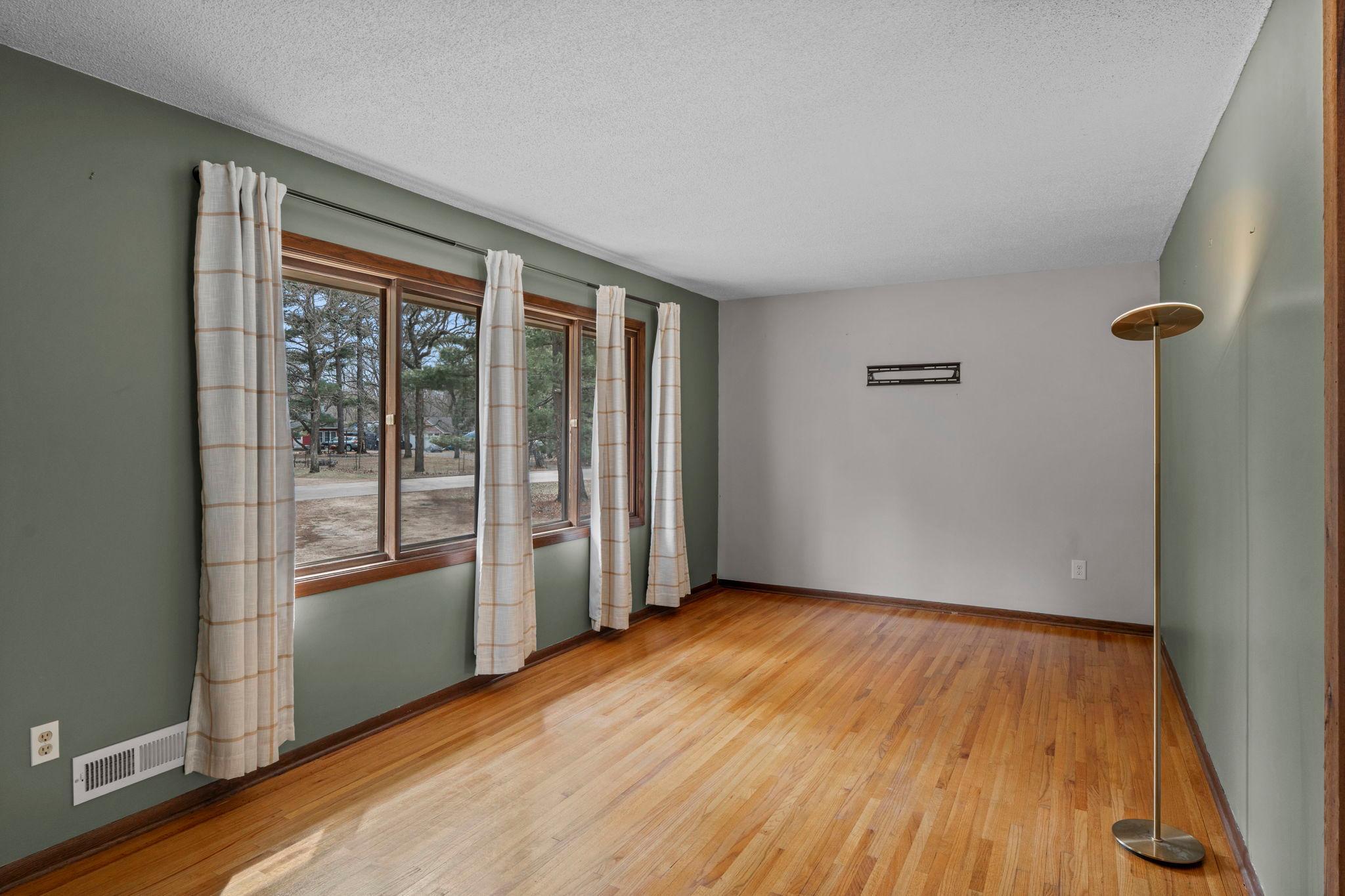 You'll notice gleaming hardwood floors as you enter.