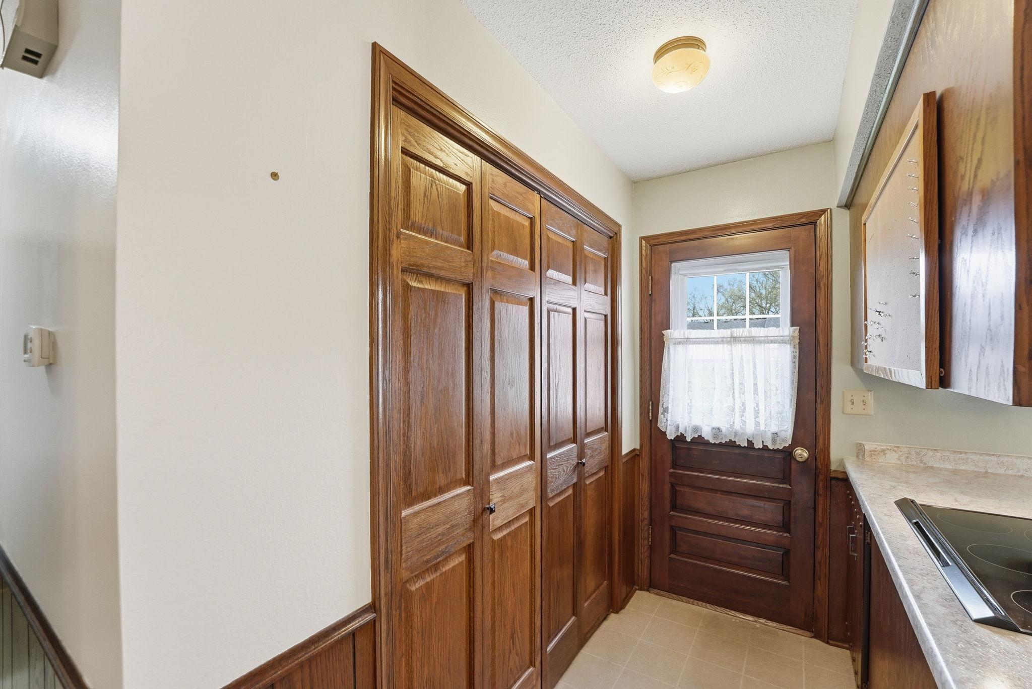 Back entry from the garage with handy closet right off the kitchen as well.