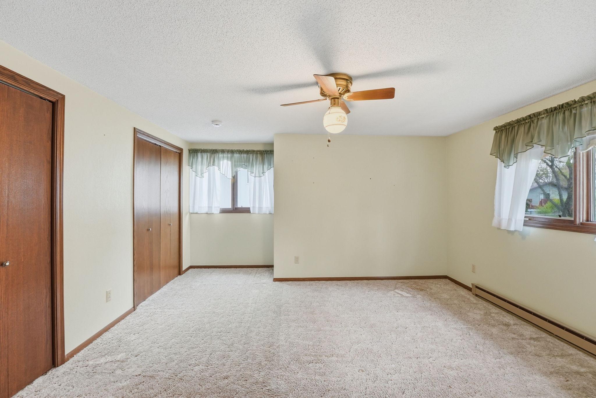 Bedroom #2 on the upper level with double closets.
