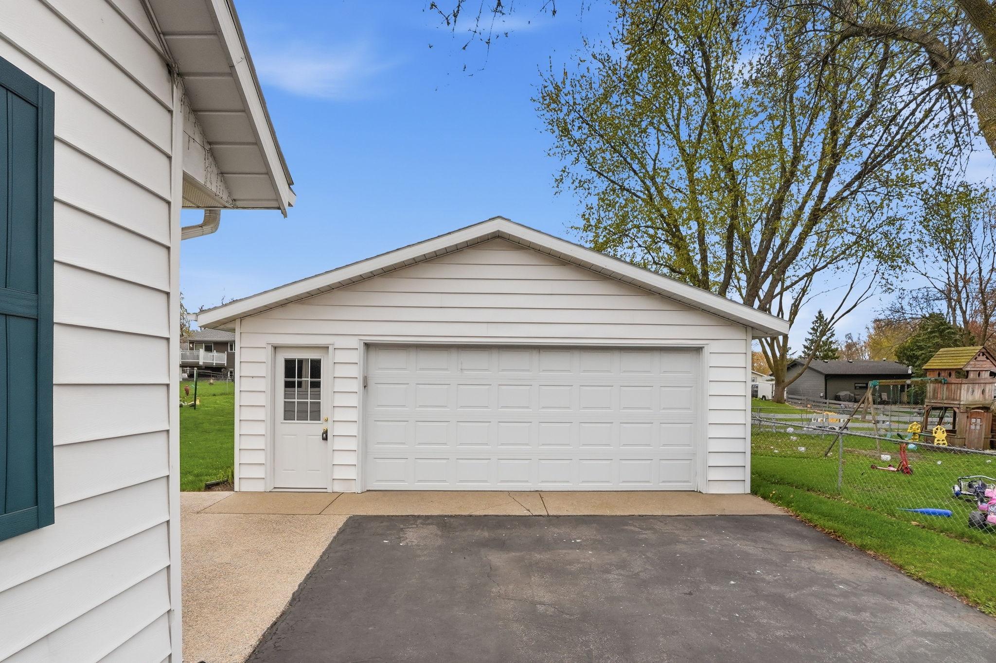 Detached 2 stall garage with room for additional storage.