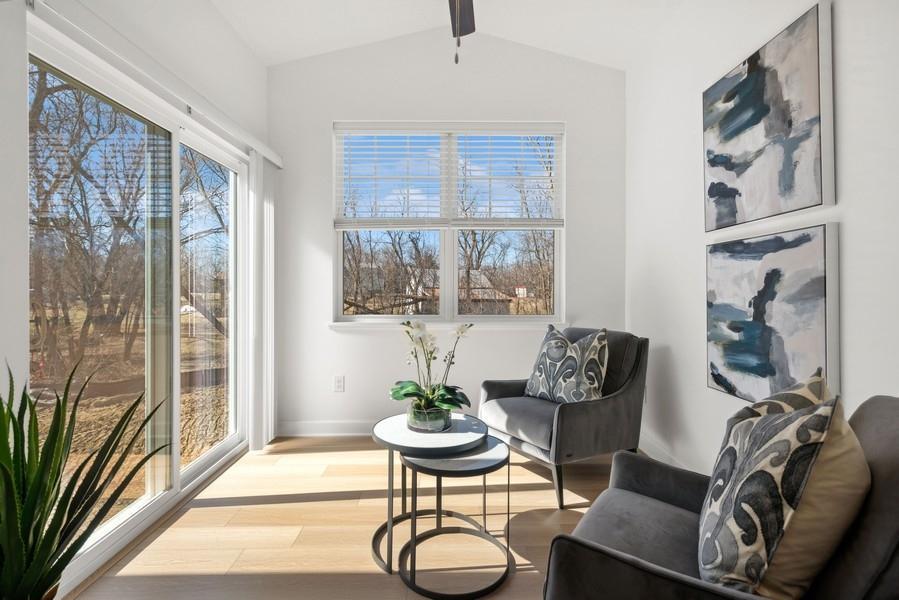 (Photo of a decorated model, actual homes finishes will vary) Look at the sunny four season porch.