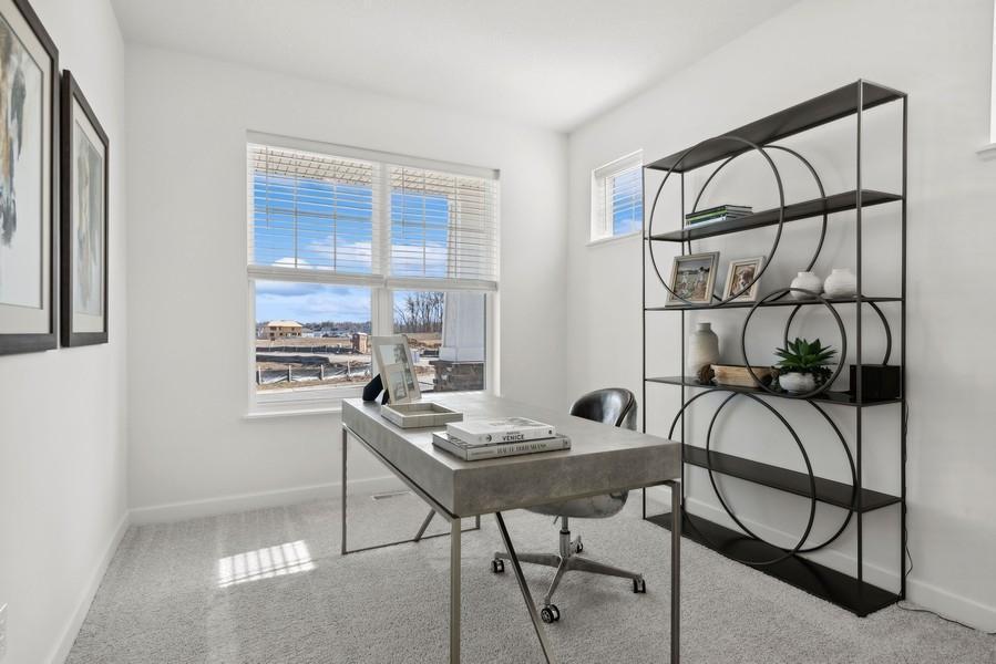 (Photo of a decorated model, actual homes finishes will vary) The upper level secondary bedroom can be used as a home office!