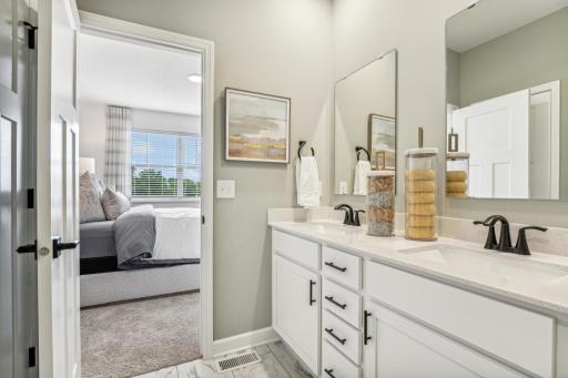 (Photo of a decorated model, actual homes finishes will vary) The primary bath.