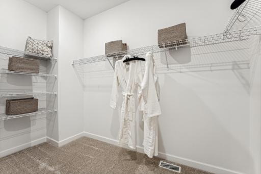 (Photo of a decorated model, actual homes finishes will vary) The primary bedroom features an incredible walk-in closet.
