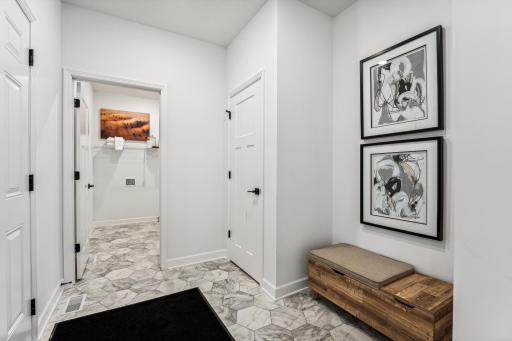 (Photo of a decorated model, actual homes finishes will vary) The mudroom!