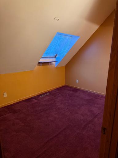 BR1 Spacious upper-level bedroom showcasing sweeping sky views by day and sparkling stars by night.
