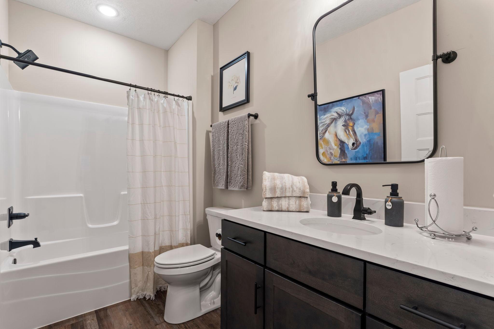 Main/guest bath across from the guest bedroom/den.