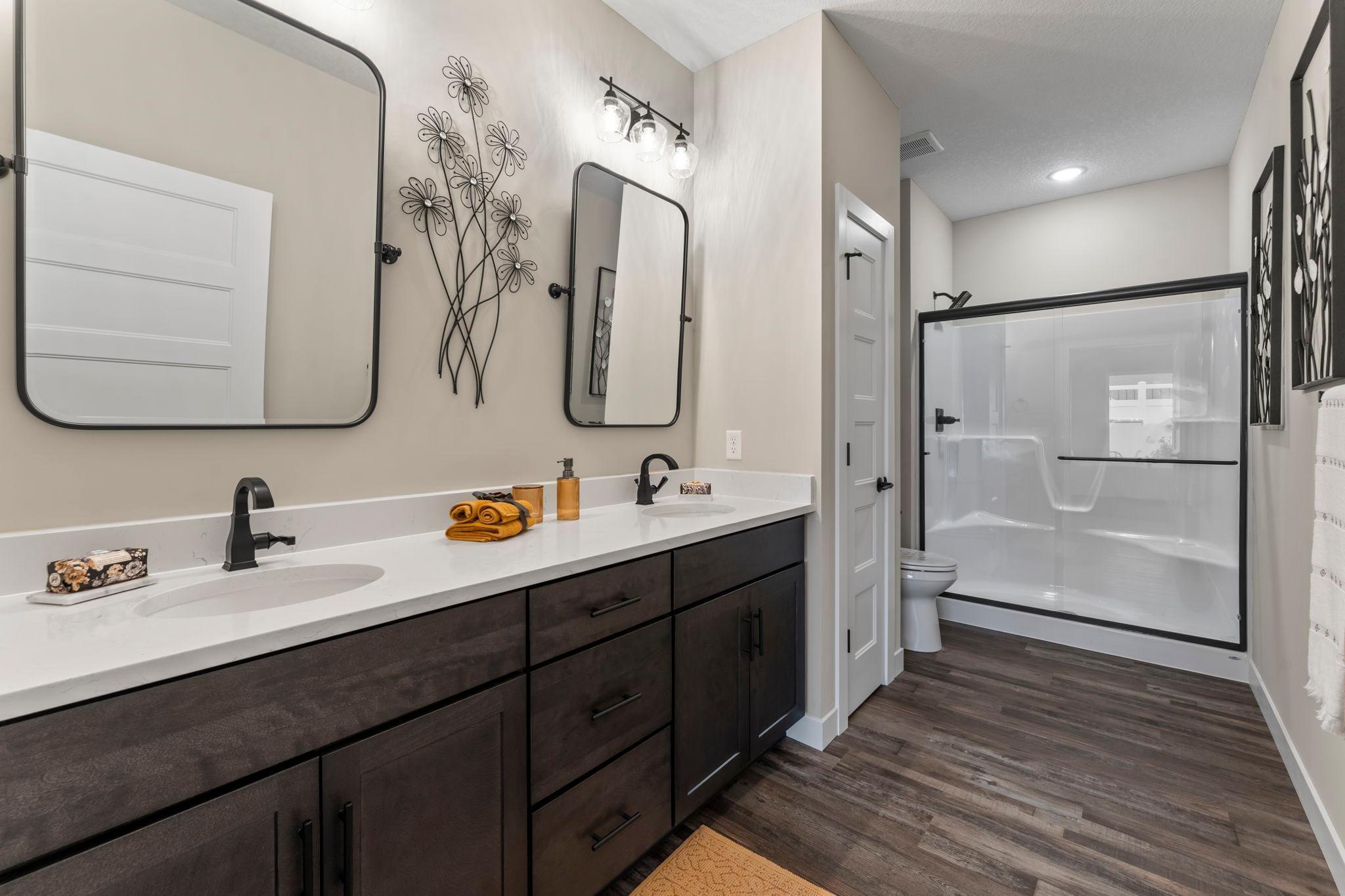 Look at the size of this bathroom! Not only does it have double sinks, but an actual linen closet!