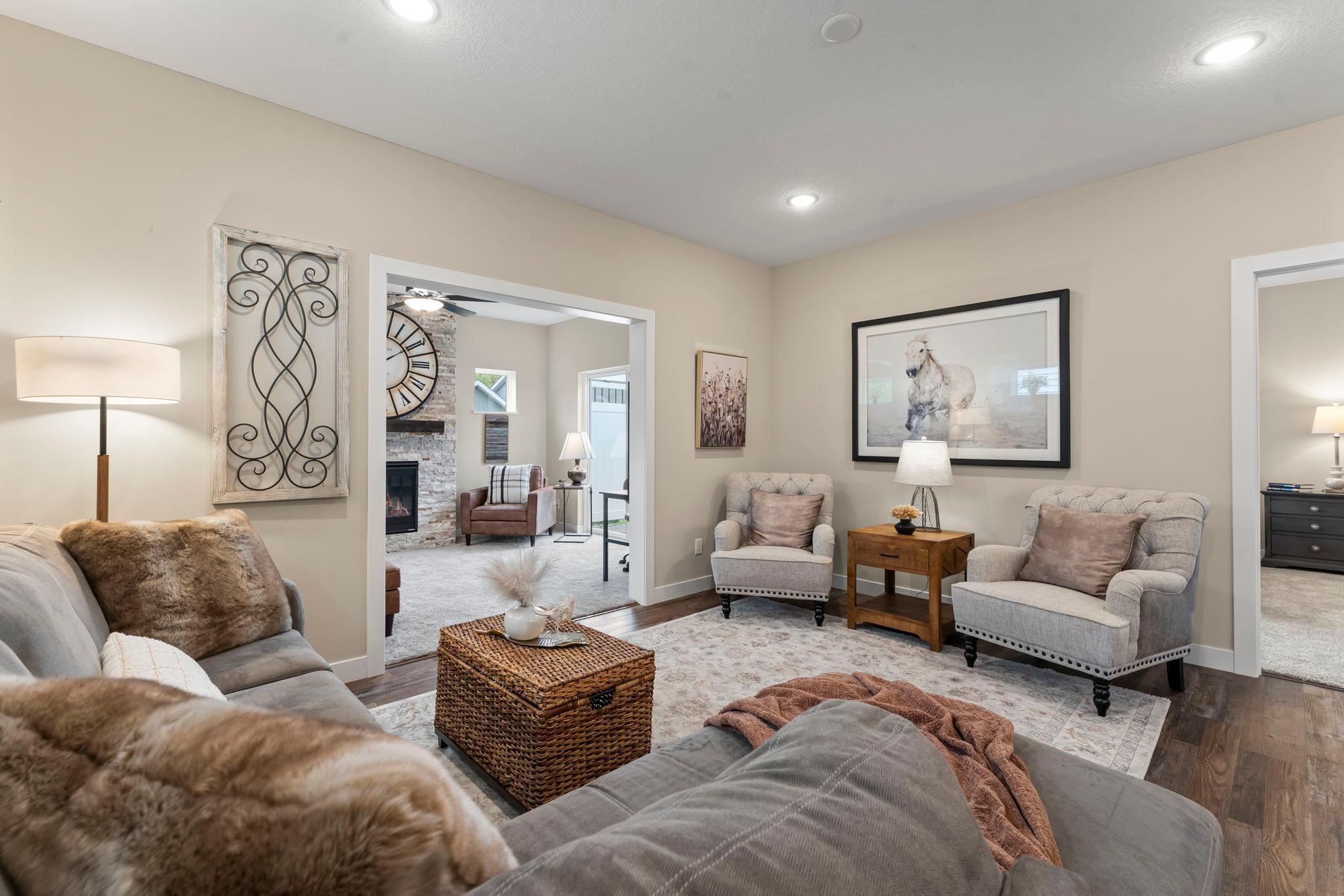 Notice the location of the sunroom and primary suite in relation to the kitchen/dining/living area.