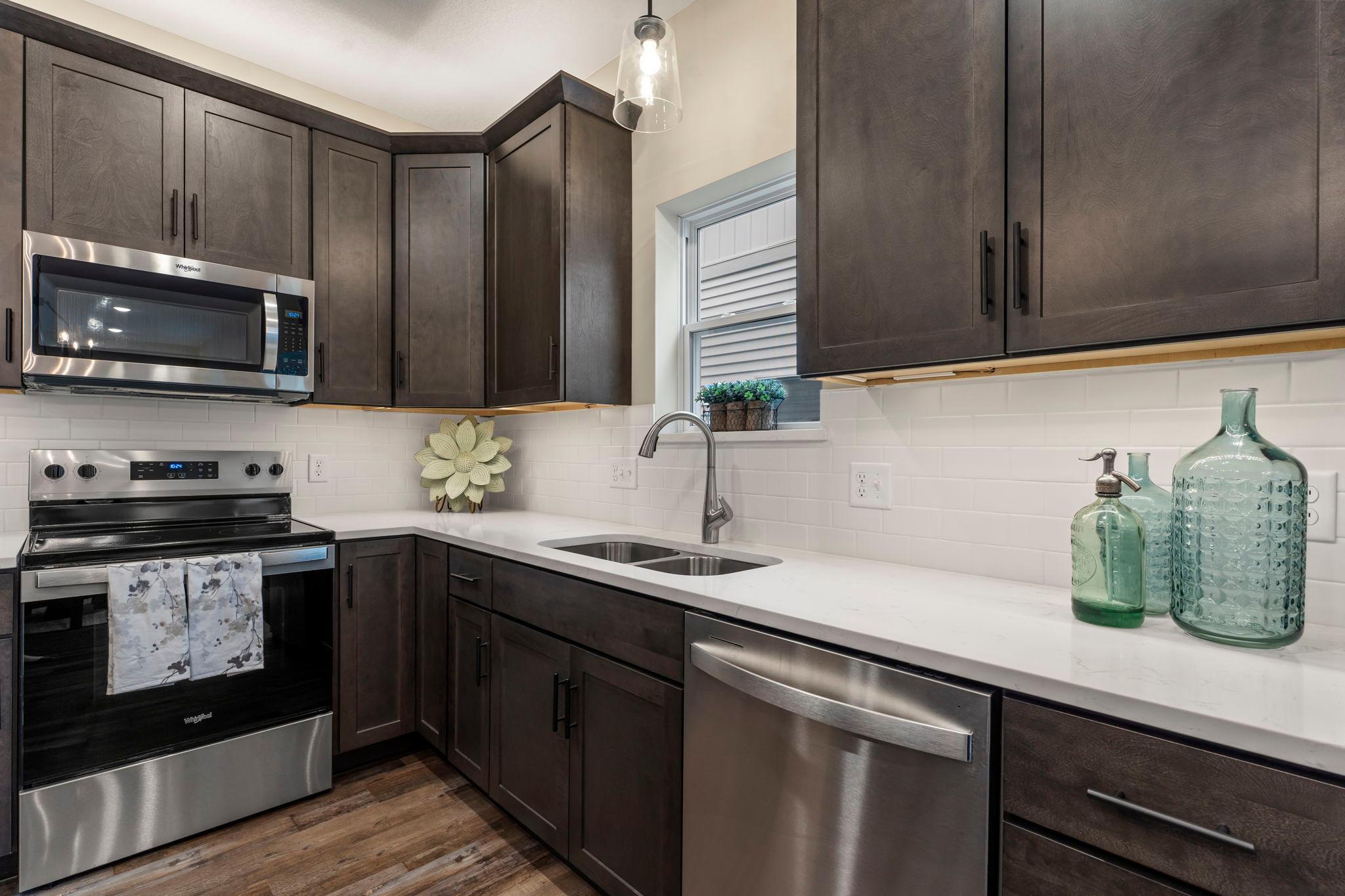 We offer a custom option of the microwave in the center island instead of the standard over the range microwave. You will have a lot of fun decisions to make should you decide to build to your specifications.