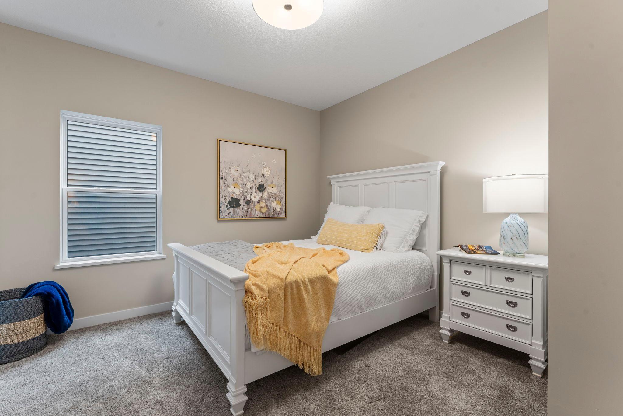 The guest bedroom/den is located at the front of the house across from the main/guest bath. It also features closet organizers as a standard feature in our homes.