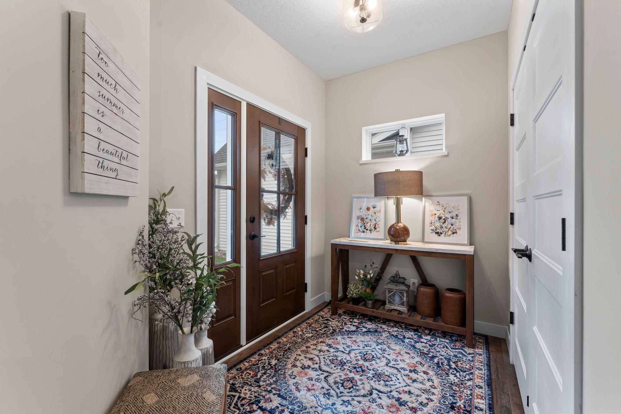 This foyer features a very large coat closet and provides privacy to the rest of the home.