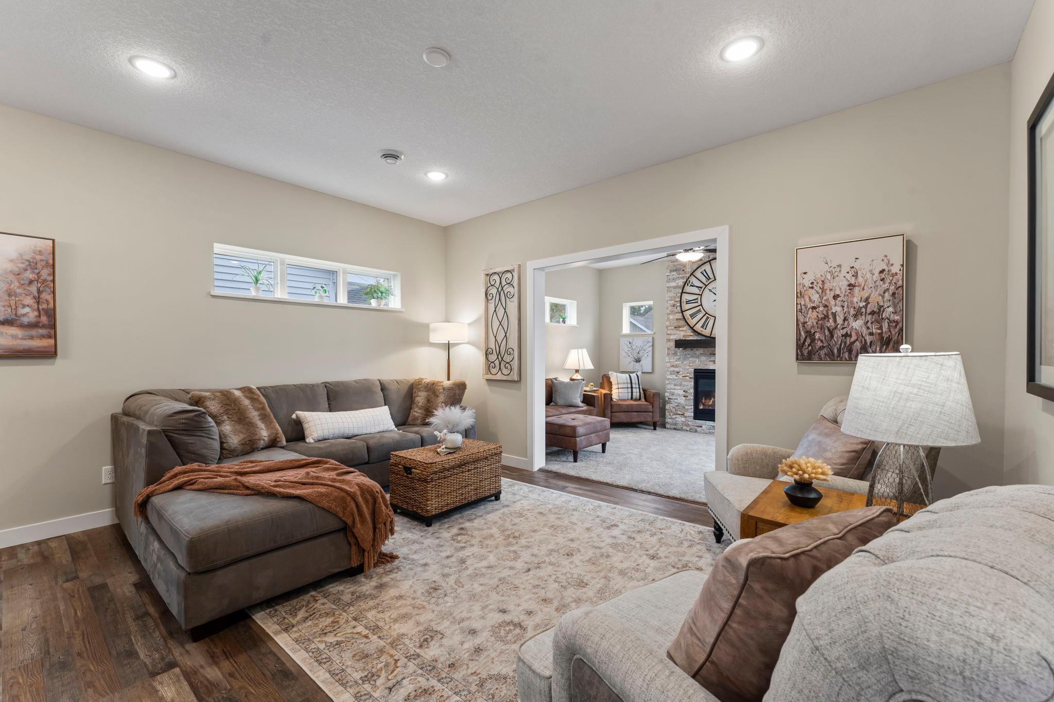 The triple transom window in the living room is standard in all homes. It provides natural light, yet privacy and wall space for your decor.