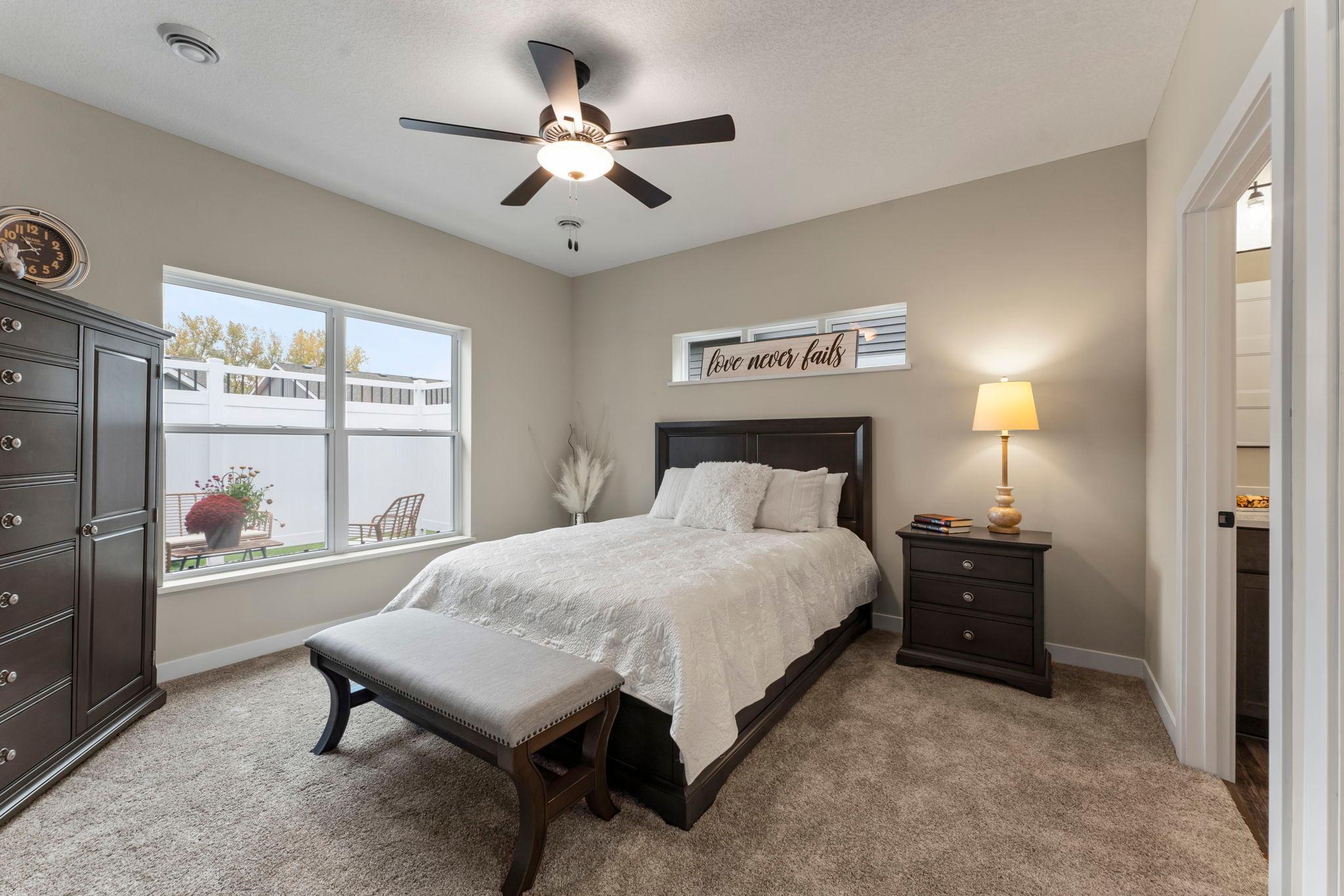 The primary suite is located at the back of the home for privacy.