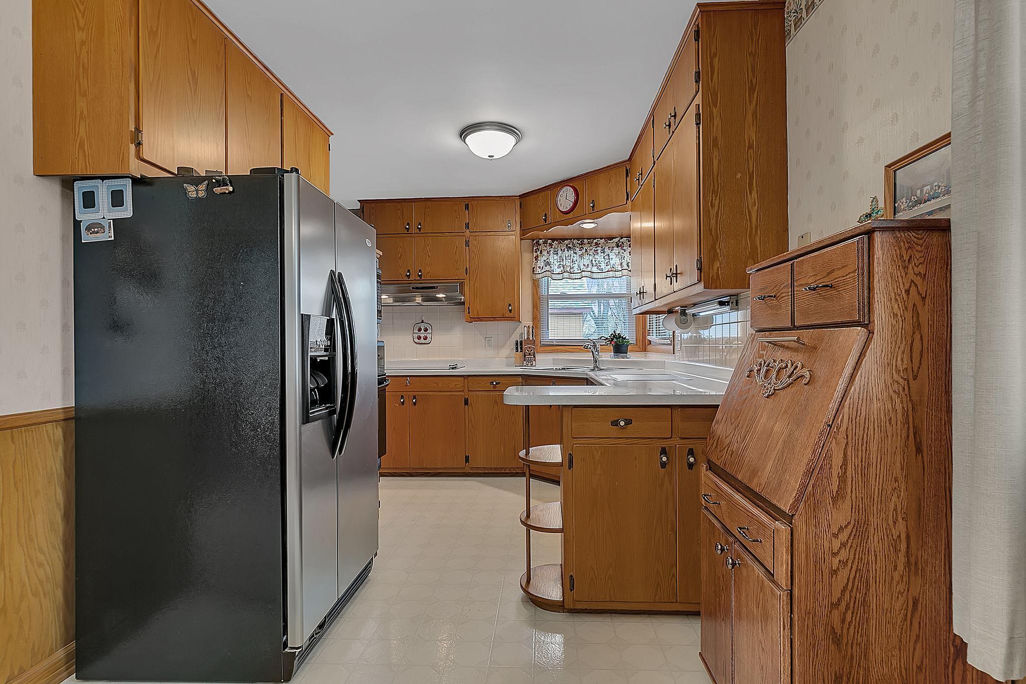 Cozy kitchen with thoughtful details and an efficient layout that makes great use of space.