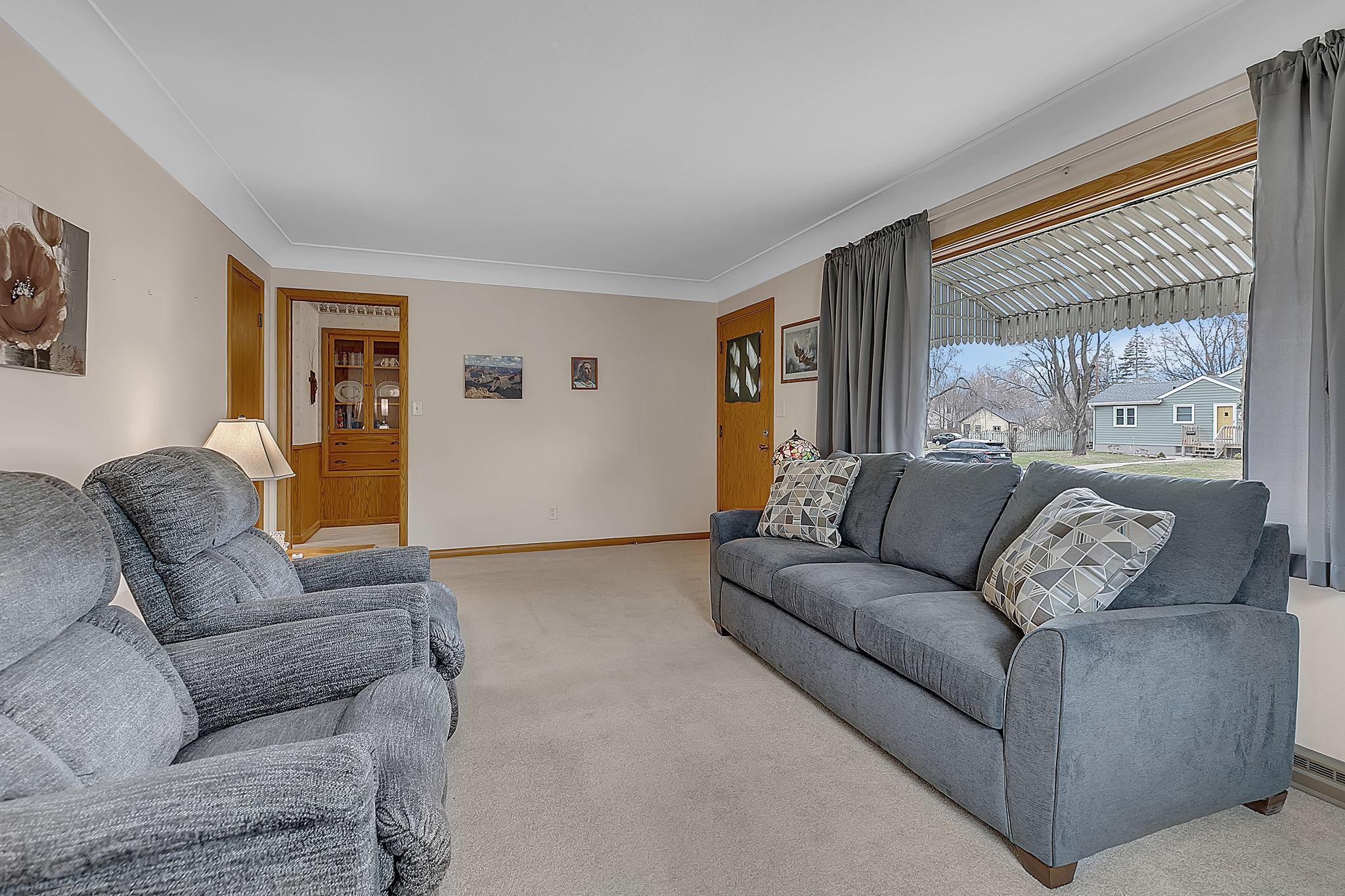 Large windows allows natural light to flood this space.