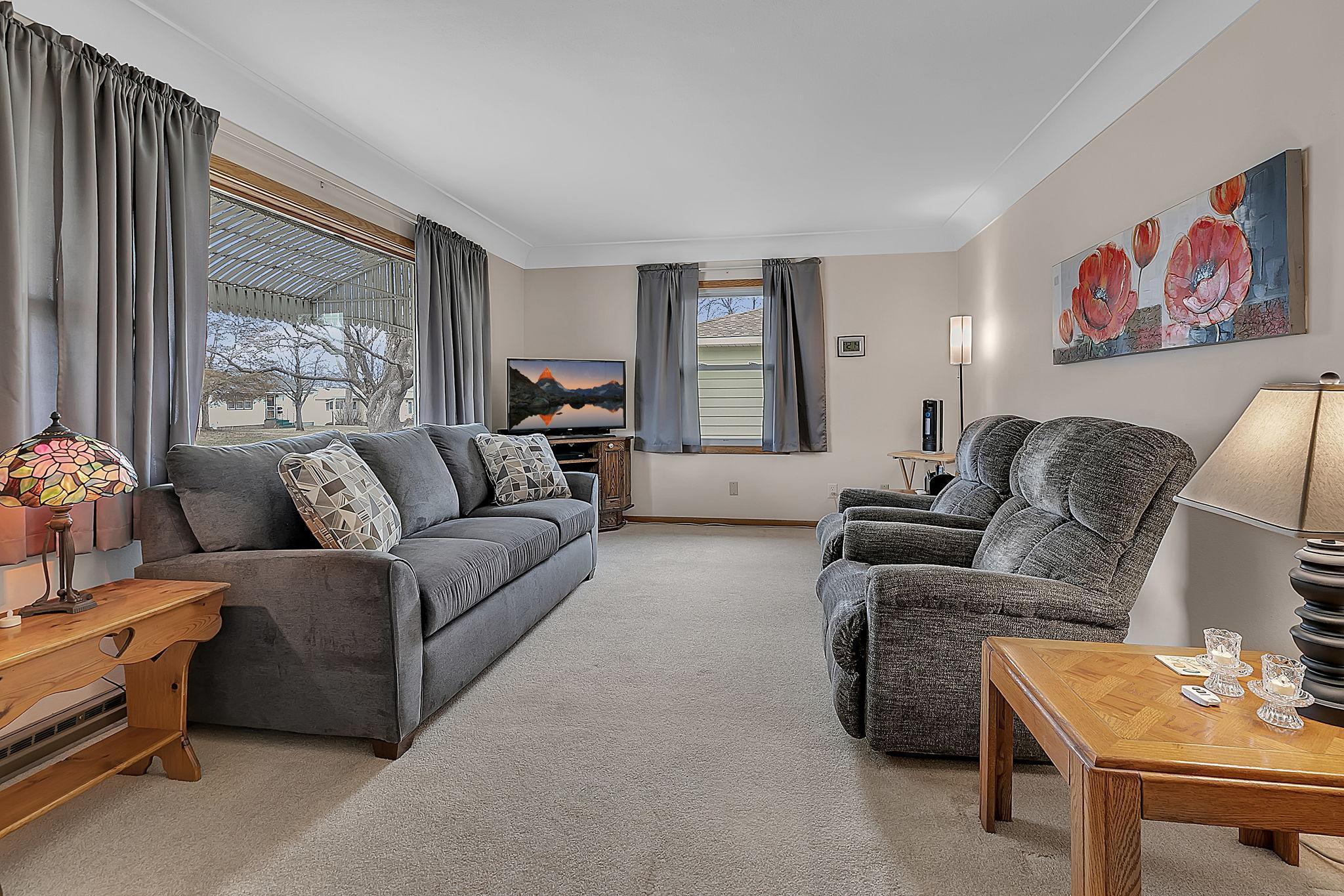 Well lit and inviting front living room.