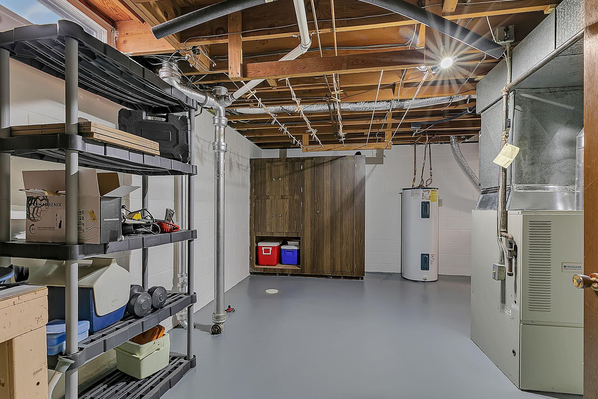 Expansive and clean mechanical room doubles as storage space.
