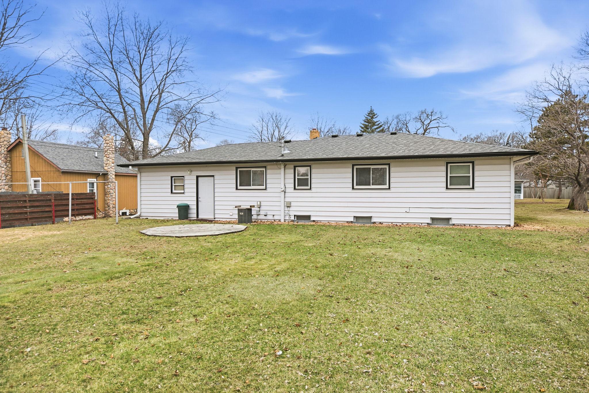 Service door lends access to the garage.