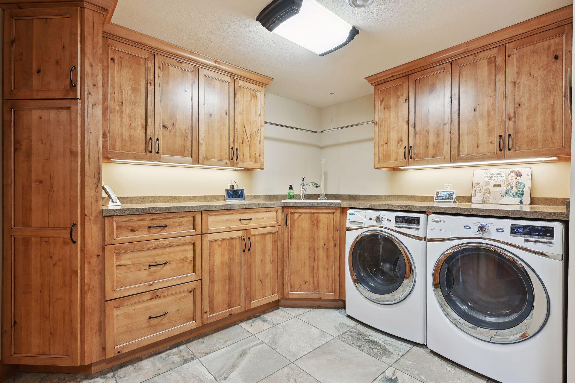 Main laundry room adjacent to the kitchen and mud room. There is a second laundry for seasonal use in the bathhouse.