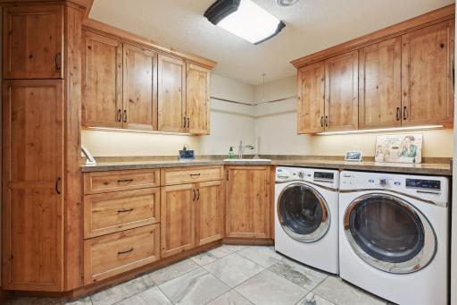 Main laundry room adjacent to the kitchen and mud room. There is a second laundry for seasonal use in the bathhouse.