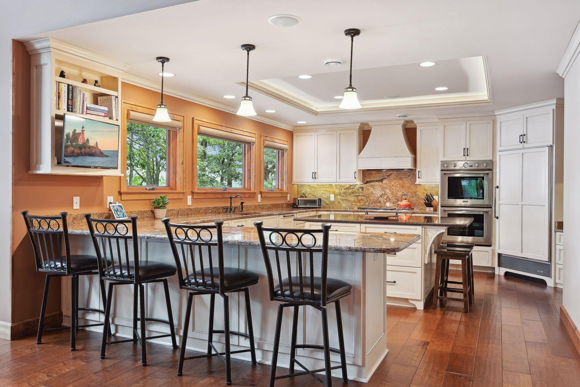 Gorgeous eat-in kitchen features both a breakfast bar peninsula and spacious center island