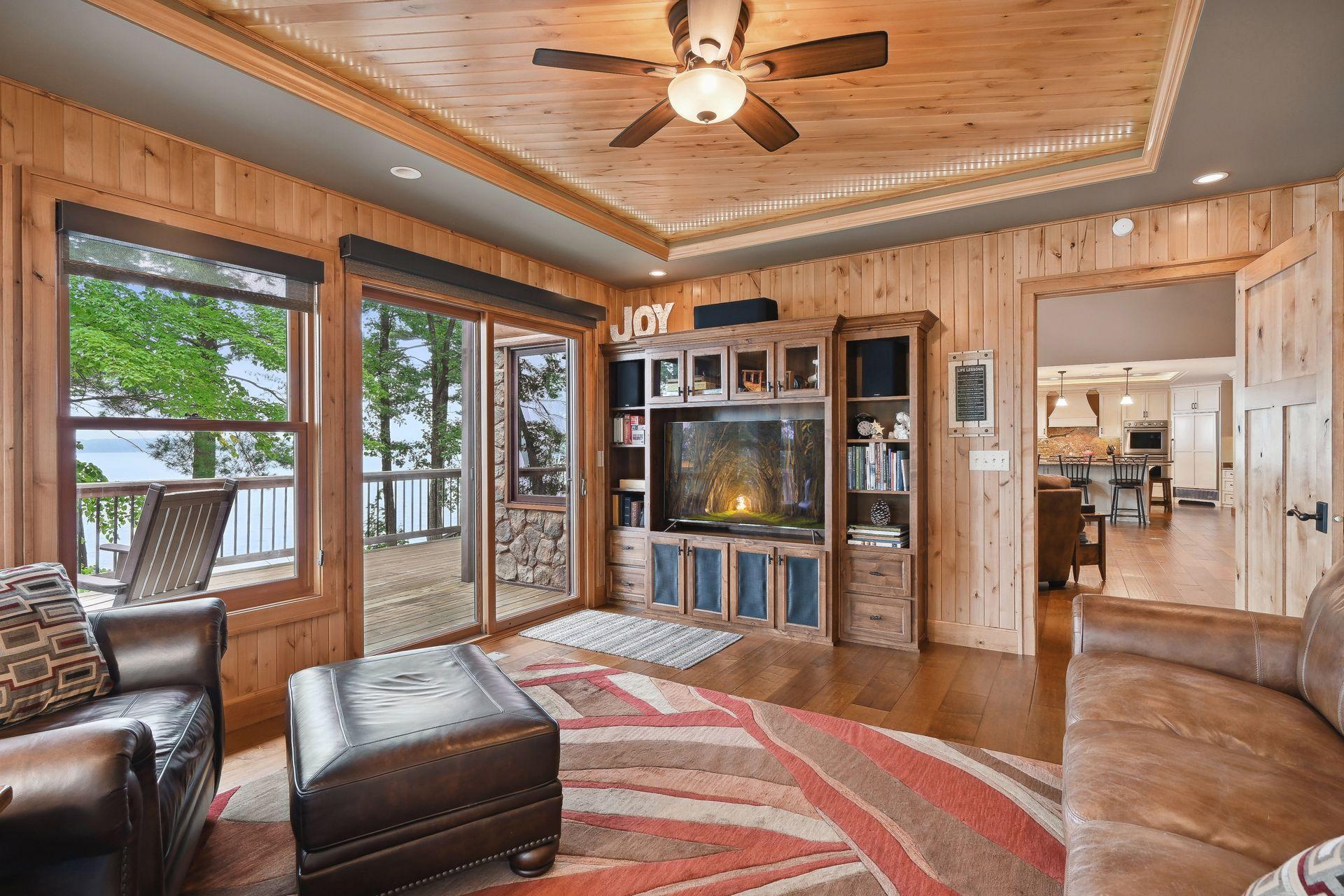 4 season porch is a charming spot to relax and enjoy the view. At night the lights in the tray ceiling give a starry night affect.