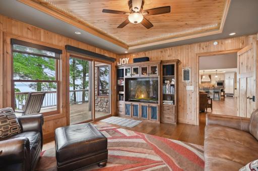 4 season porch is a charming spot to relax and enjoy the view. At night the lights in the tray ceiling give a starry night affect.