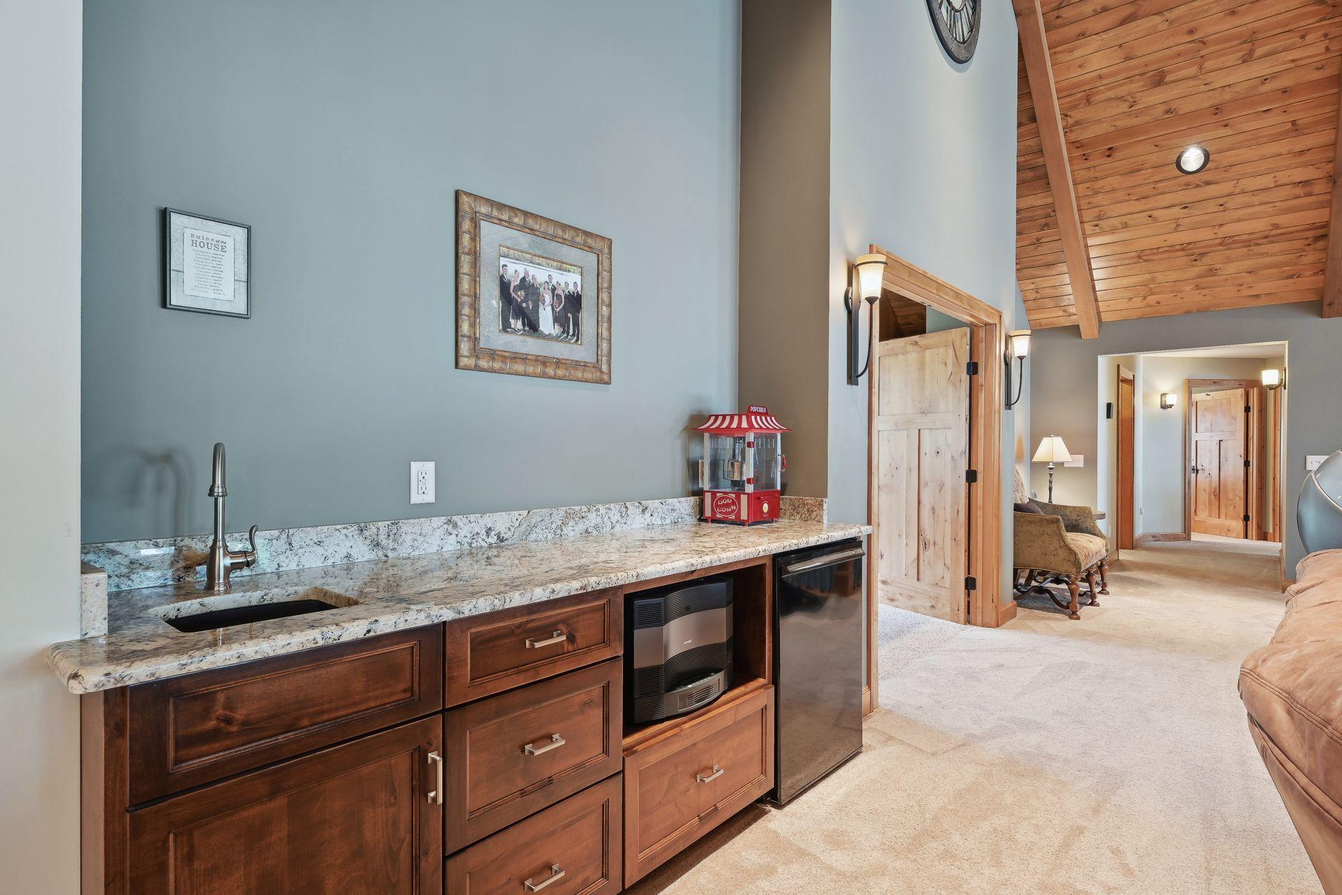 Wet bar and "concession" area perfectly situated outside the home theater