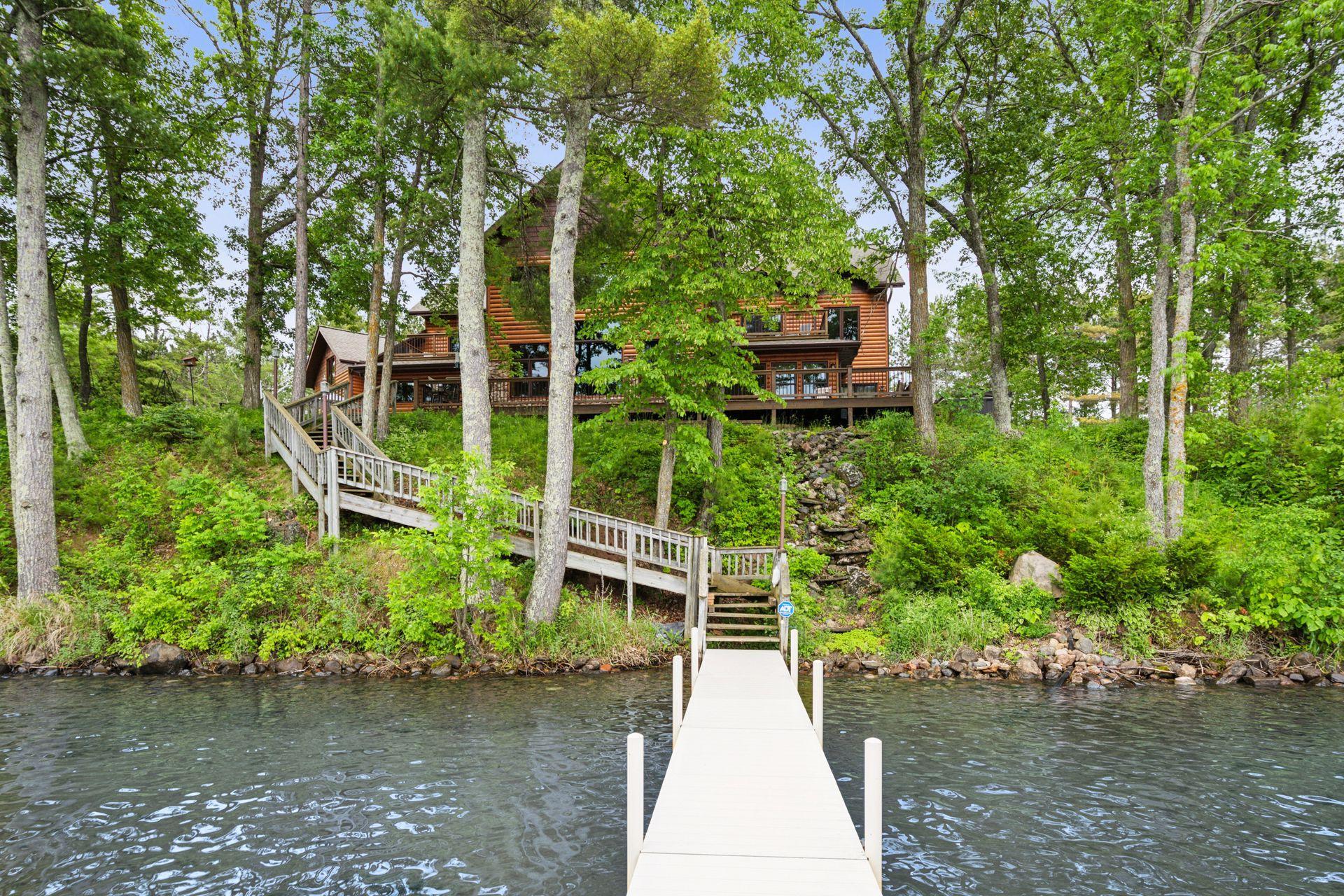 Boat dock and waterfall feature great your lakeside guests
