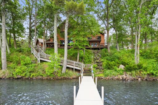Boat dock and waterfall feature great your lakeside guests