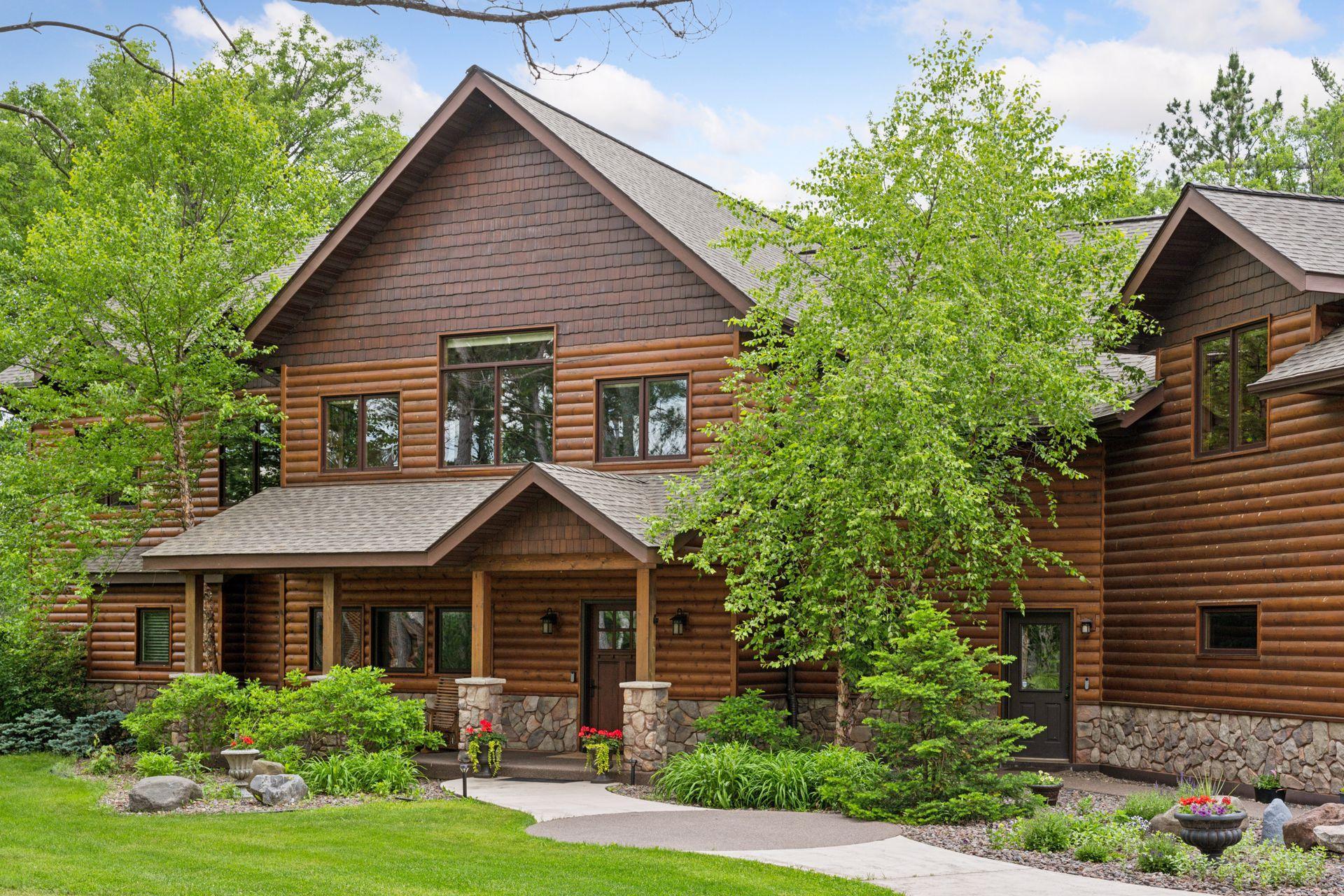 Inviting entry walk includes a covered front porch, lovely landscaping and a no-step second entry door
