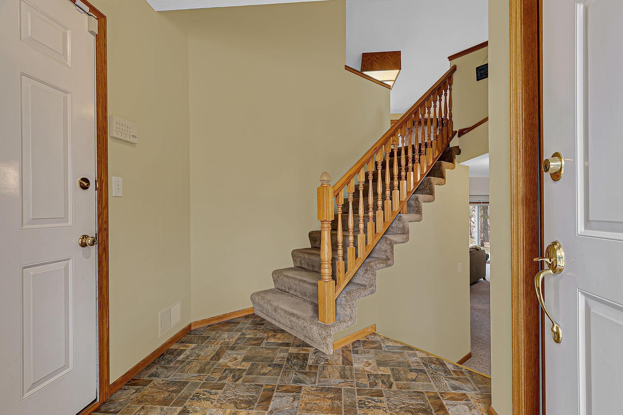 Functional foyer with space for coats, shoes, and other outdoor apparel.