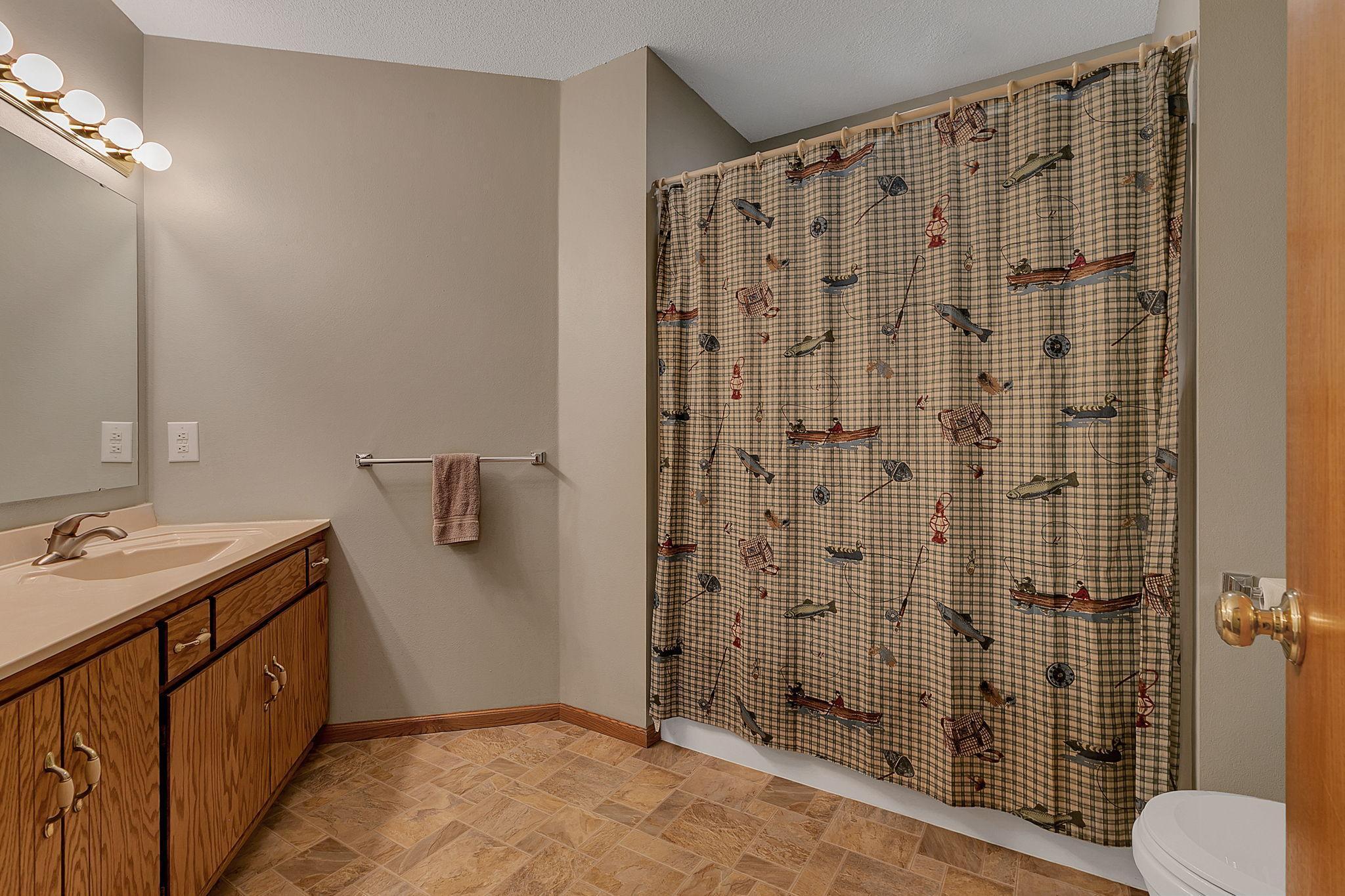 Upper level shared full bathroom.