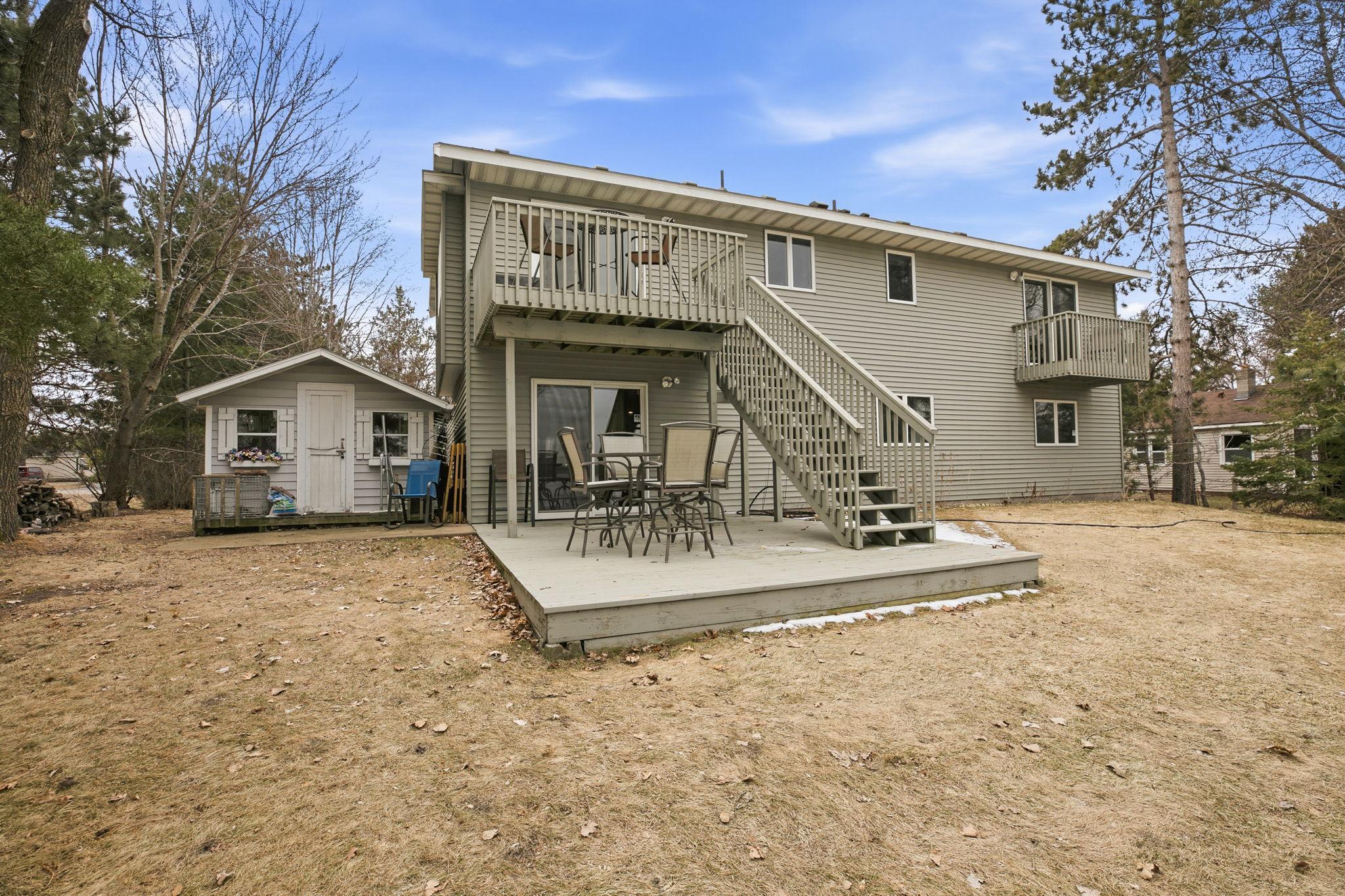 Expansive upper deck walks down to a lower deck, creating ideal spaces for entertaining and enjoying the outdoors.