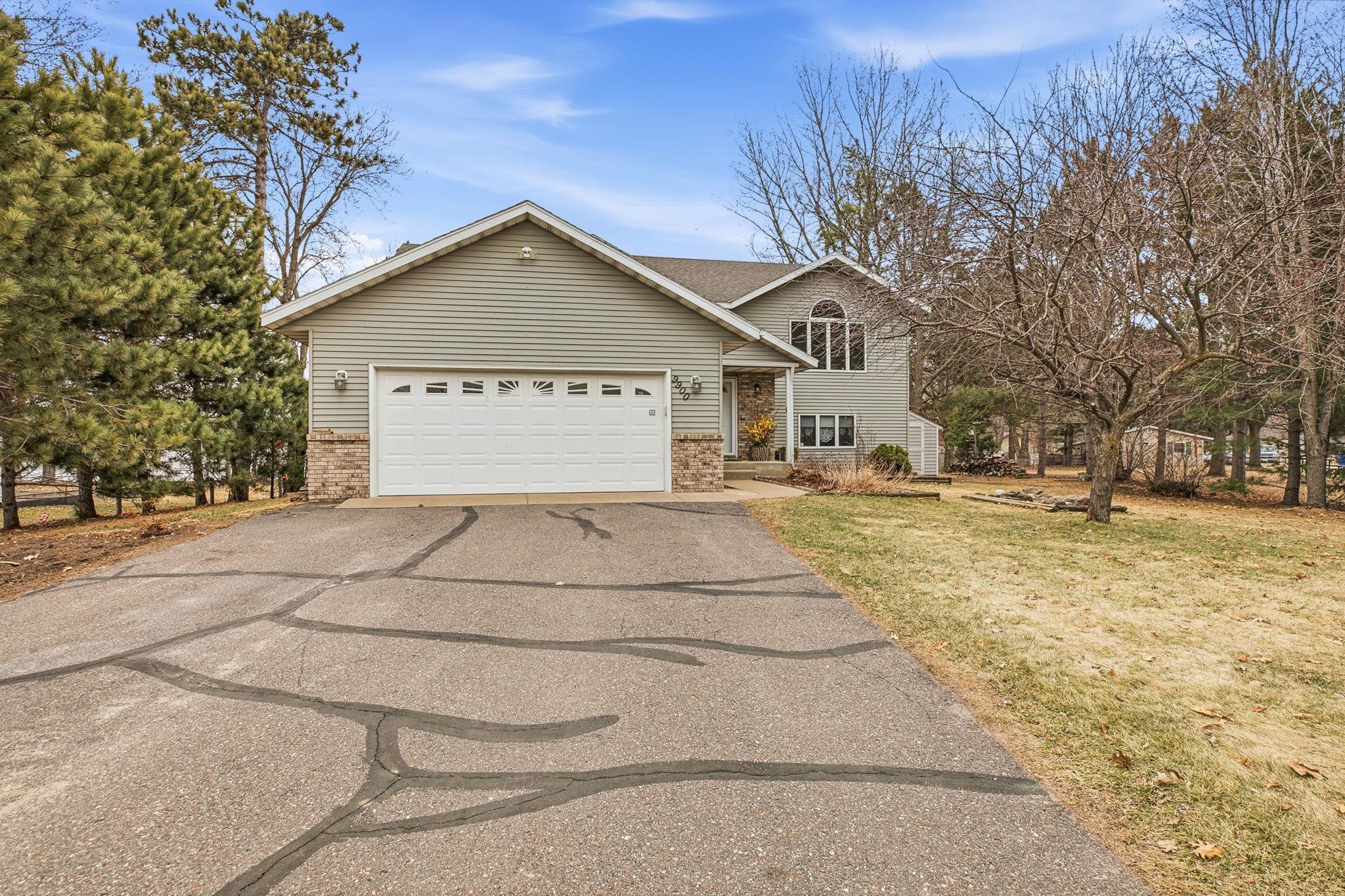 2 stall garage with driveway space for multiple vehicles.