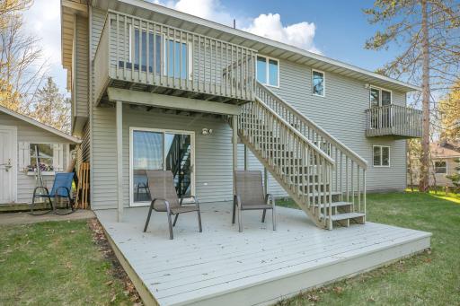Expansive upper deck walks down to a lower deck, creating ideal spaces for entertaining and enjoying the outdoors.