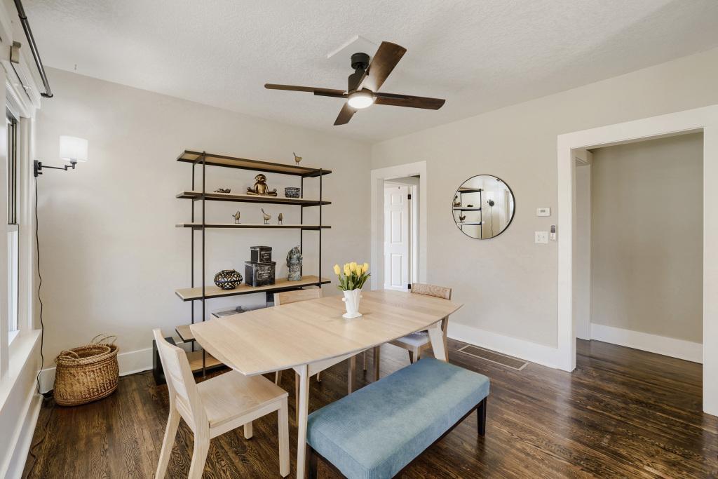 Another view of the dining room. Note the updated neutral paint colors and modern fan.