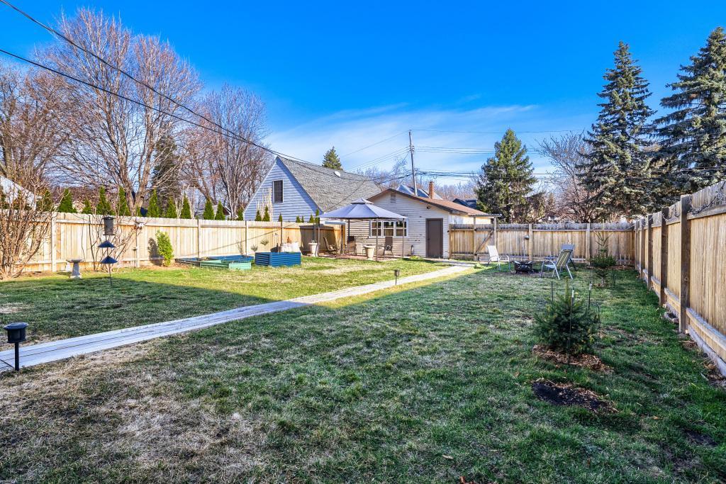 The privacy fence around the backyard makes for an enjoyable and private place to spend time. Note the home has a 2-car garage and 2 parking stalls as well behind the fence!