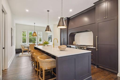 Oversized island maximizes the seating, storage and counterspace in the chef's kitchen