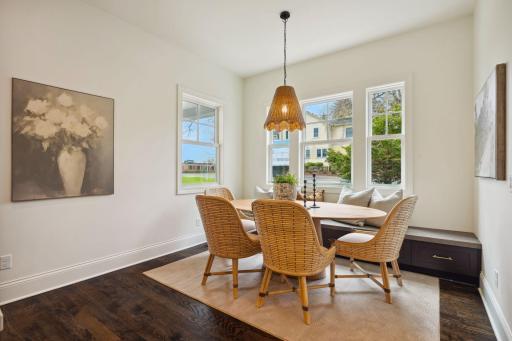Informal dining area features built-in bench seating with storage