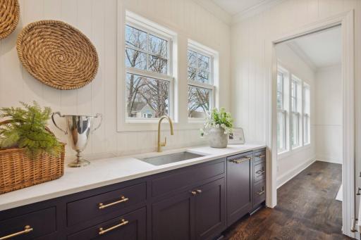 Butlers pantry with featuring sink, dishwasher and wine cooler