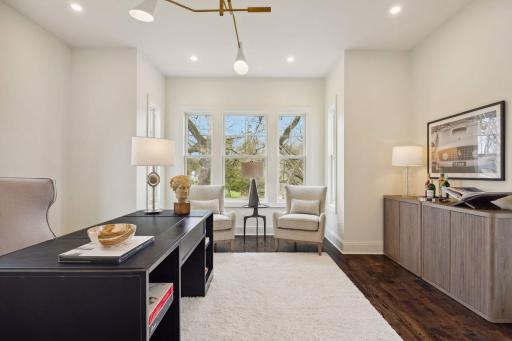 Main floor office with views of the pond and door to the front porch