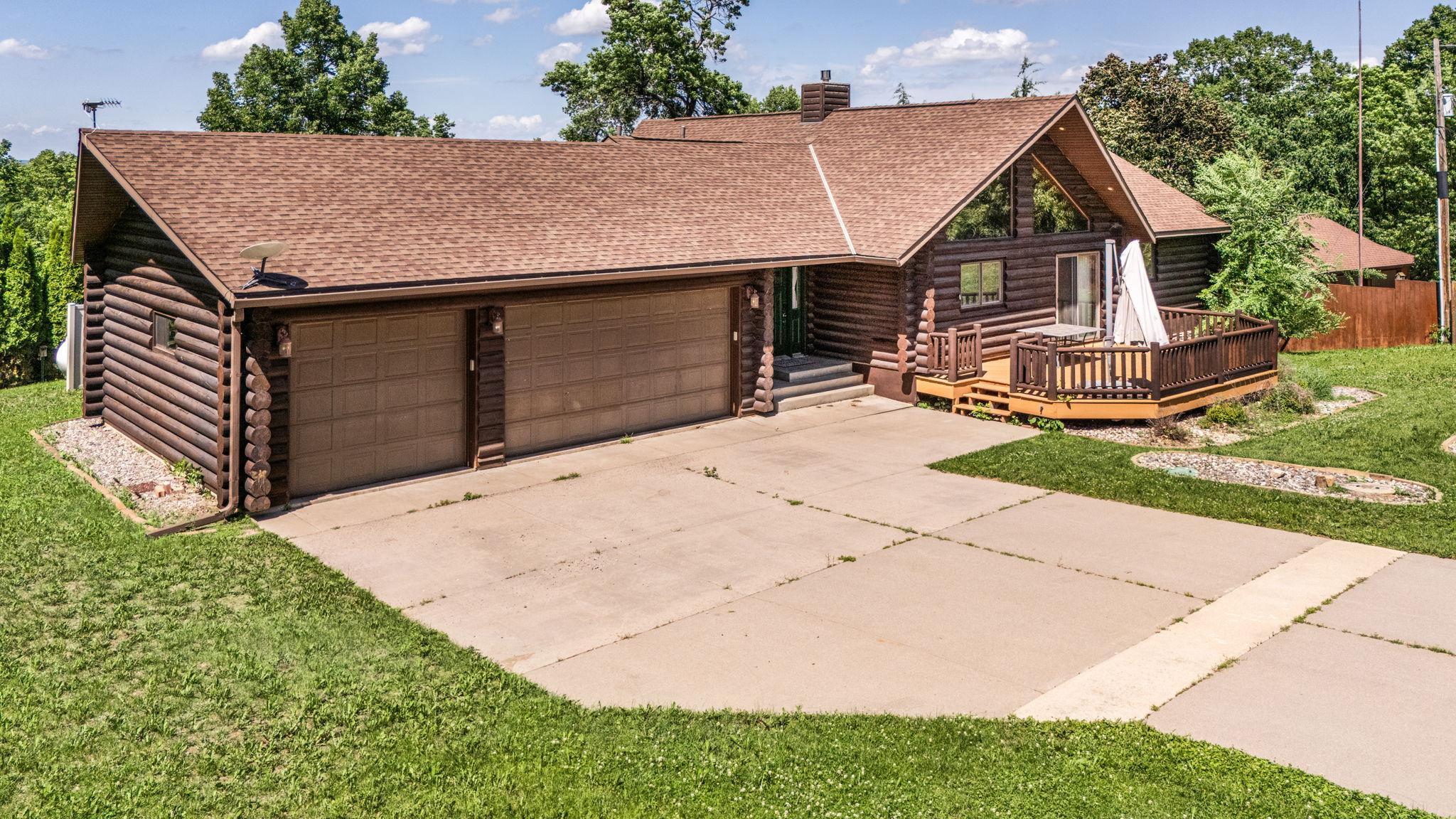 Driveway space accommodates multiple vehicles.
