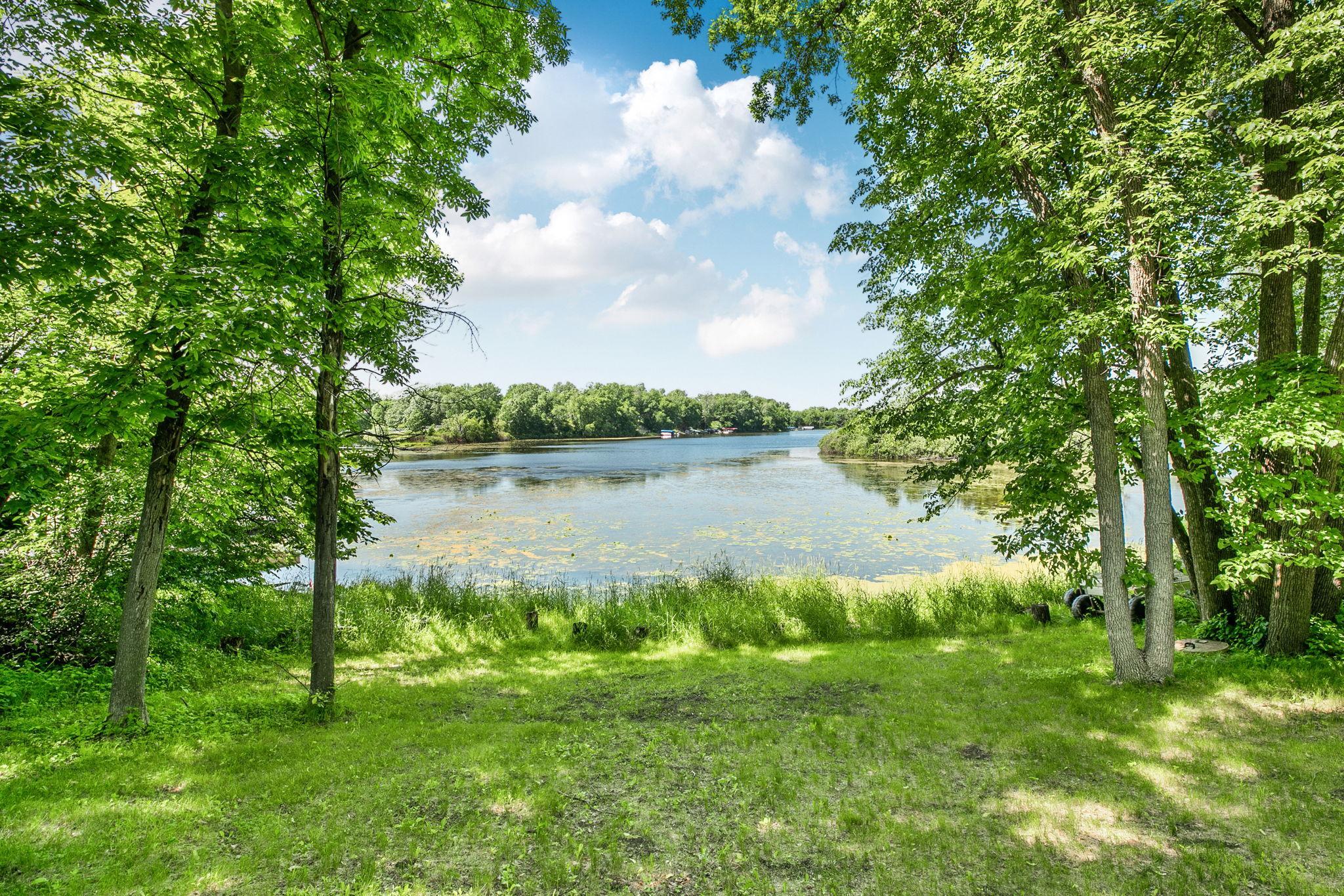 Well-maintained yard with open space and natural surroundings.