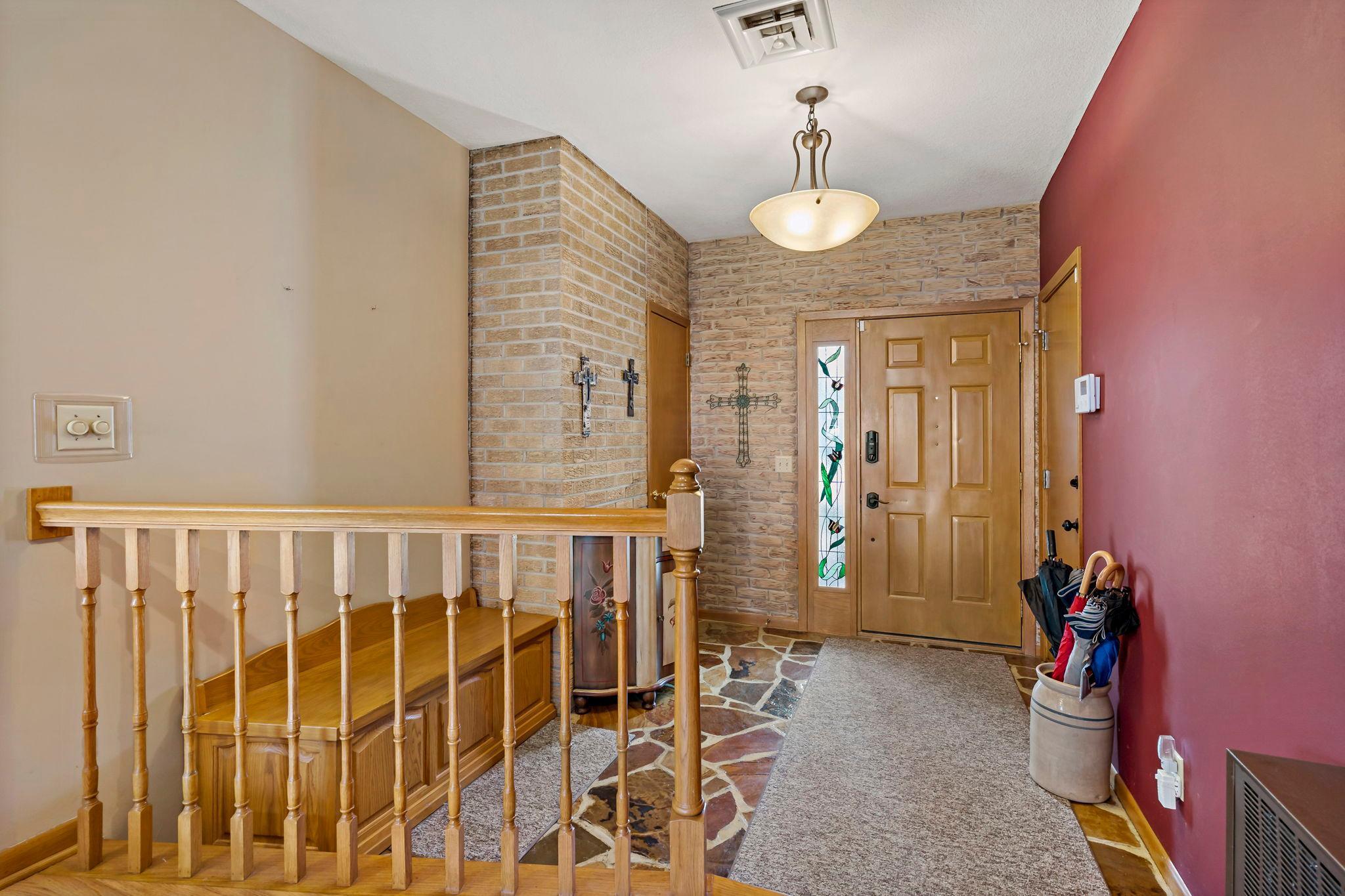 Spacious entry with coat closet.